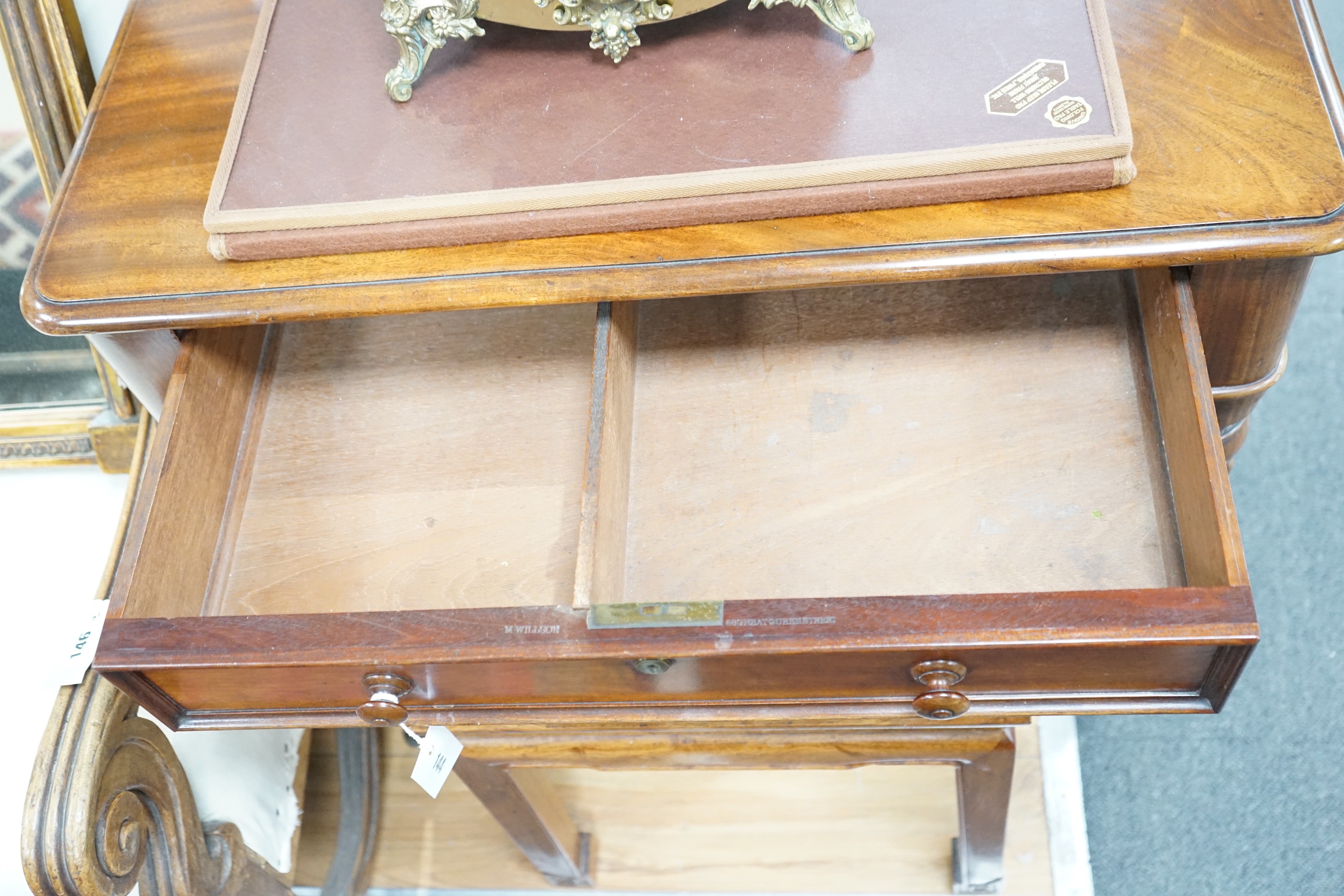 An early Victorian mahogany writing table stamped M Willson, 68 Great Queen Street, width 76cm, depth 48cm, height 74cm